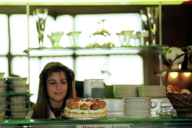 A teenager eyes a profiterole gateau in Nardini's cafe at Largs in July 1991. Picture: TSPL