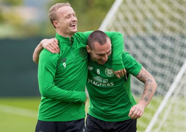 Celtic captain Scott Brown, right, plays it for laughs with team-mate Leigh Griffiths during training. Picture: SNS.