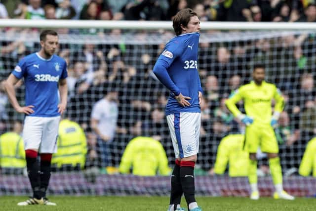 Rangers' Josh Windass is dejected at full time after losing 5-1 to Celtic at Ibrox in April. Picture: Alan Harvey/SNS