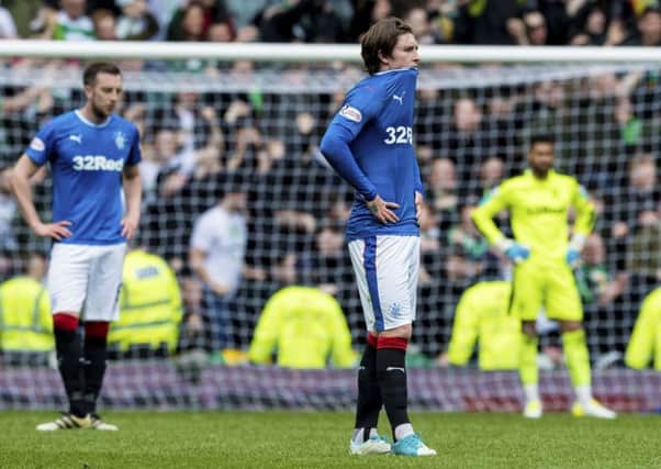 Rangers' Josh Windass is dejected at full time after losing 5-1 to Celtic at Ibrox in April. Picture: Alan Harvey/SNS
