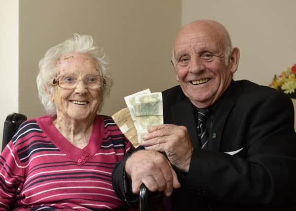 Michael Doherty, 77, from Greenock, has found his first pay packet 62 years after giving it to his  mother Margaret, 104, for safekeeping. Picture: SWNS