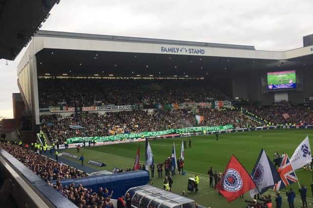 Celtic fans unveil a banner aimed at their rivals. Picture: Craig Fowler
