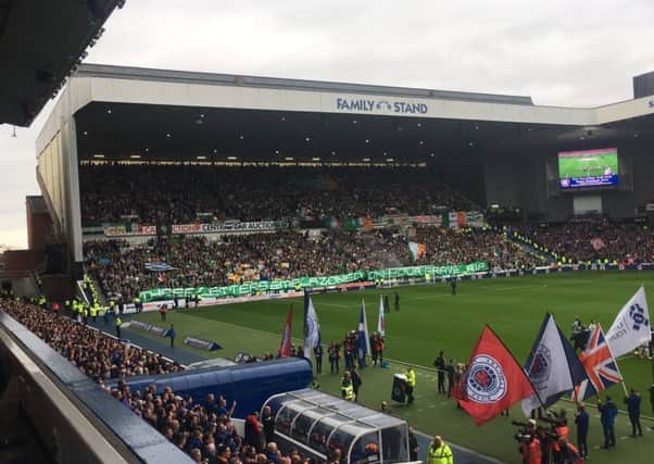 Celtic fans unveil a banner aimed at their rivals. Picture: Craig Fowler