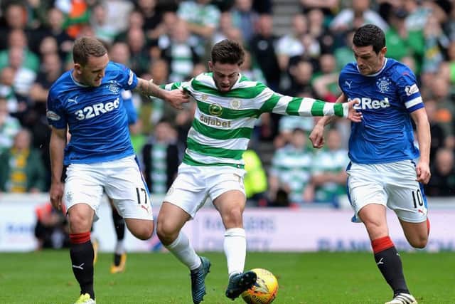 Patrick Roberts attempts to get past Graham Dorrans of Rangers and Lee Hodson. Picture: Mark Runnacles/Getty Images