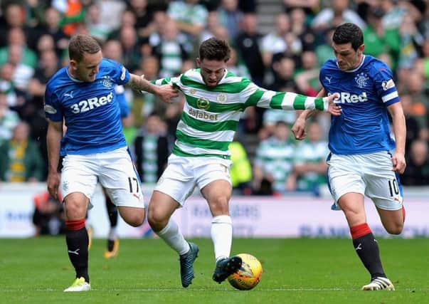 Patrick Roberts attempts to get past Graham Dorrans of Rangers and Lee Hodson. Picture: Mark Runnacles/Getty Images