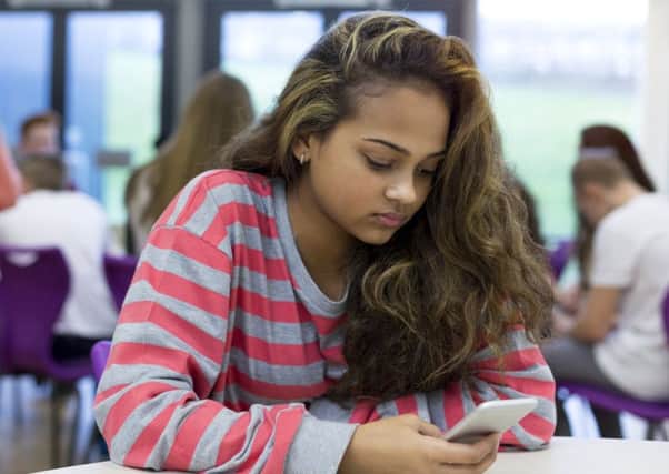 Too often the message girls receive on their smartphones is that they will be judged on their looks. Picture: Getty/iStockphoto