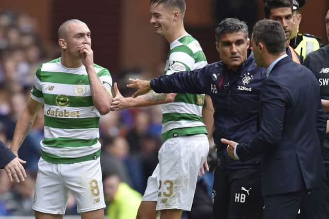 Celtic's Scott Brown exchanges words with Rangers manager Pedro Caixinha. Picture: SNS/Rob Casey