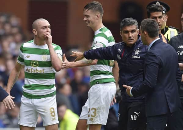 Celtic's Scott Brown exchanges words with Rangers manager Pedro Caixinha. Picture: SNS/Rob Casey