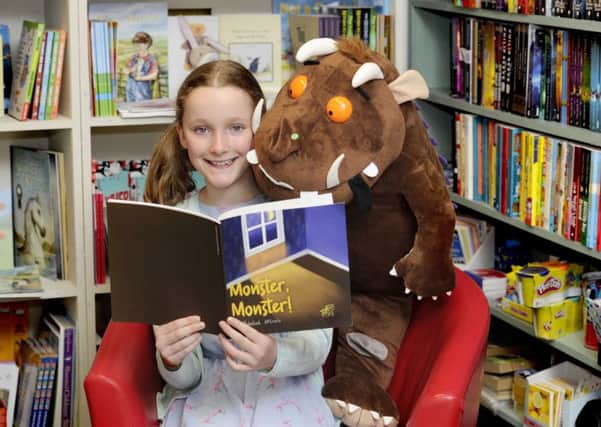 10-year-old author Rebekah McCrorie with her first book "Monster Monster!", at the launch of the 19th annual Wigtown Book Festival. Picture: PA