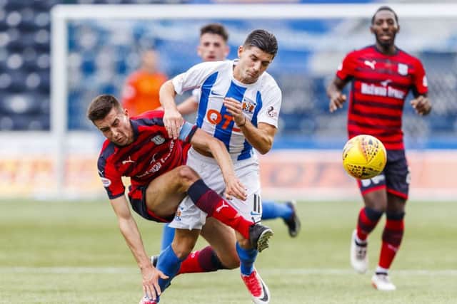 Kilmarnock's Jordan Jones in action against Cammy Kerr. Picture: SNS/Roddy Scott