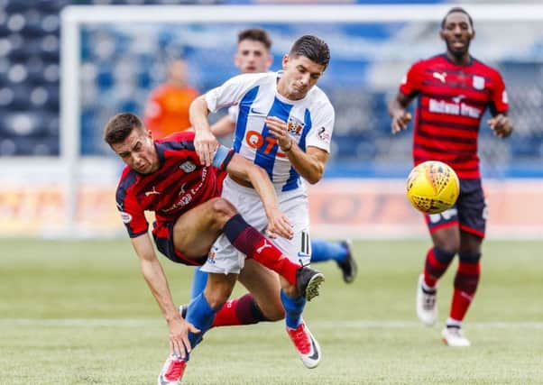 Kilmarnock's Jordan Jones in action against Cammy Kerr. Picture: SNS/Roddy Scott