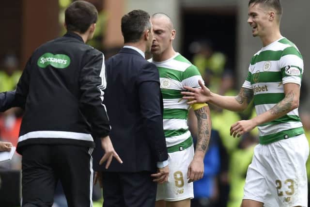 Scott Brown and Pedro Caixinha square up to each other during the game. Picture: SNS