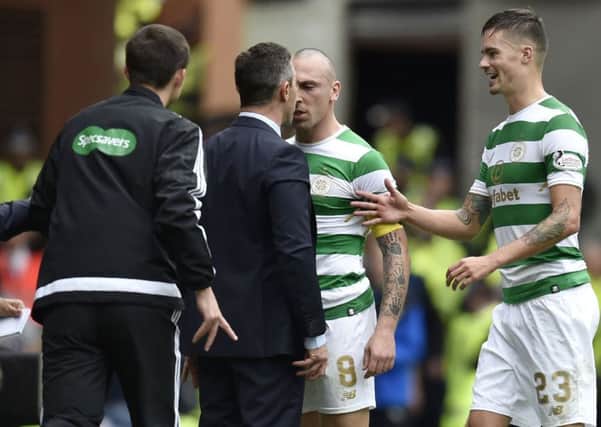 Scott Brown and Pedro Caixinha square up to each other during the game. Picture: SNS