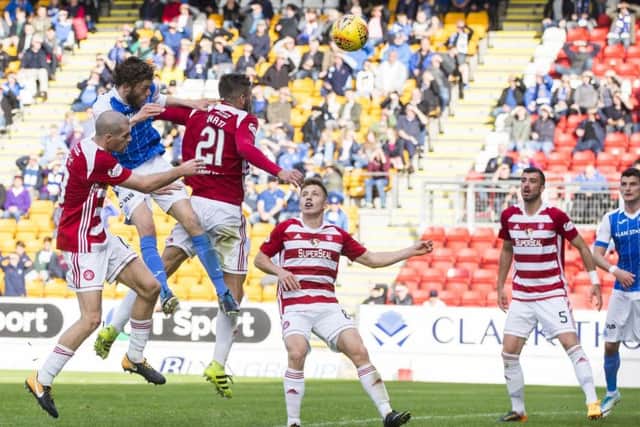 Murray Davidson, second left, heads the winning goal for St Johnstone. Picture: SNS.