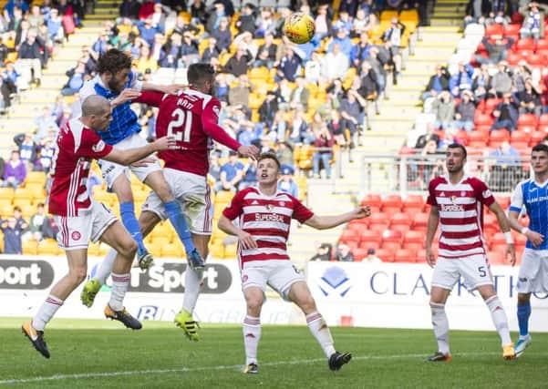 Murray Davidson, second left, heads the winning goal for St Johnstone. Picture: SNS.