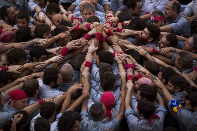 Grassroots groups driving Catalonia's independence movement say they have started distributing one million ballots to be used in a referendum on secession that the Spanish government has vowed to stop. (AP Photo/Emilio Morenatti)