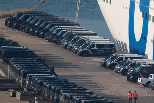 Spanish Police vans are parked next to a ferry ship, rented by the Spanish Interior Ministry to house National Police and Civil Guard police officers, at Barcelona port on September 24, 2017 in Barcelona, Spain. (Photo by David Ramos/Getty Images)