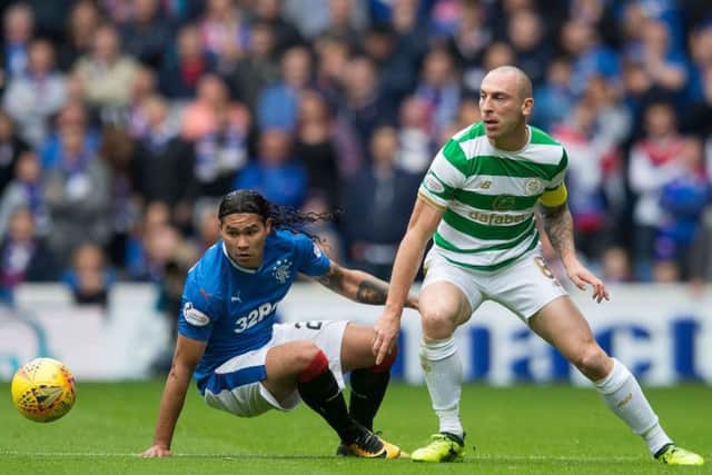 Scott Brown was head and shoulders above Carlos Pena at Ibrox on Saturday as Celtic eased to victory over Rangers. Picture: Jeff Holmes/PA