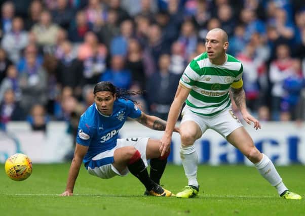 Scott Brown was head and shoulders above Carlos Pena at Ibrox on Saturday as Celtic eased to victory over Rangers. Picture: Jeff Holmes/PA