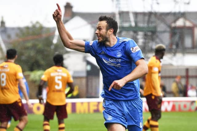 Aberdeen's Andrew Considine celebrates in front of the away support after scoring the only goal of the match. Picture: SNS