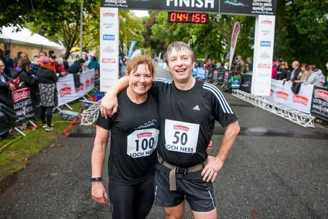 Sarah-Louise Grigor, 47, and Chris Cull, 49 at the finish line. Picture: PA