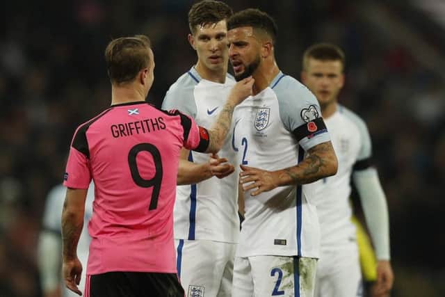 Leigh Griffiths and Kyle Walker both sporting poppies as they enjoy a friendly disagreement during the England-Scotland match in November 2016. Picture: Getty Images