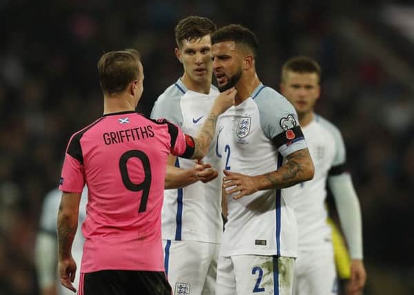 Leigh Griffiths and Kyle Walker both sporting poppies as they enjoy a friendly disagreement during the England-Scotland match in November 2016. Picture: Getty Images