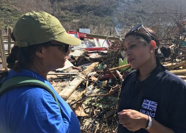 International development secretary Priti Patel (right) inspects some of the damage caused by Hurricane Maria in Tortola, the British Virgin Islands. Pictures: Georgina Stubbs/PA