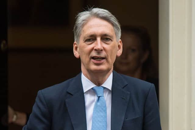 Chancellor Philip Hammond said the Scottish Government should be 'cautious about increasing the pressure on household incomes through taxation'. Picture: PA