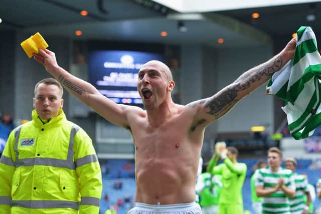 Scott Brown celebrates after Celtic's 2-0 victory at Ibrox. Picture: Getty