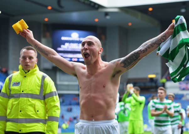 Scott Brown celebrates after Celtic's 2-0 victory at Ibrox. Picture: Getty