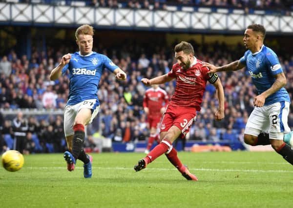 Aberdeen's Graeme Shinnie (centre) opens the scoring against Rangers at Ibrox in a previous clash. Picture: SNS Group