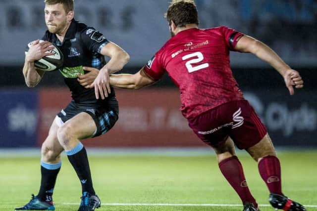 Finn Russell takes on Munster's Rhys Marshall. Picture: Bill Murray/SNS/SRU