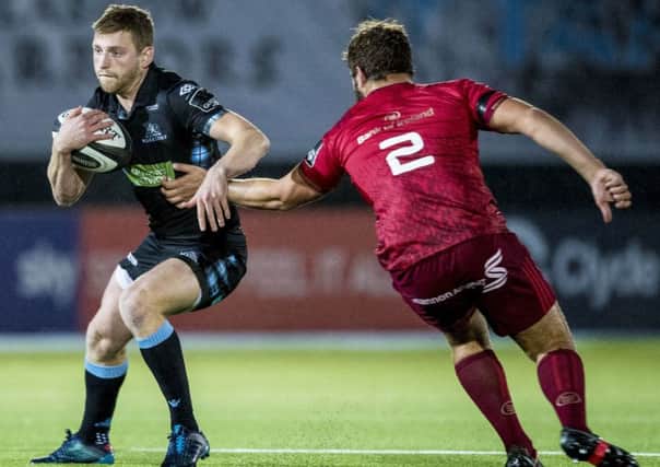 Finn Russell takes on Munster's Rhys Marshall. Picture: Bill Murray/SNS/SRU