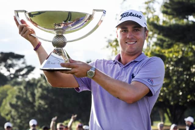 Justin Thomas with the Fedex Cup. Picture: AP Photo/John Amis