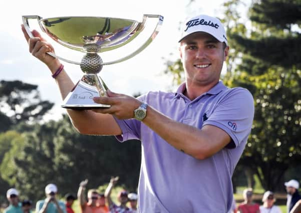 Justin Thomas with the Fedex Cup. Picture: AP Photo/John Amis