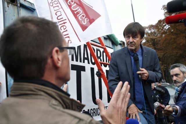 French environment minister Nicolas Hulot speaks with farmers during a protest organised by the FNSEA union. Picture: Thibault Camus/AP