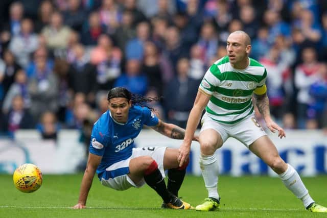 Scott Brown, right, is the lynchpin of the Celtic midfield. Picture: PA