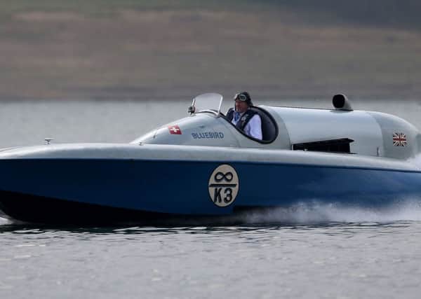 Karl Foulkes-Halbard pilots Sir Malcolm Campbell's hydroplane powerboat Bluebird K3, during a test run on Bewl water in Kent. Picture: Andrew Matthews/PA Wire