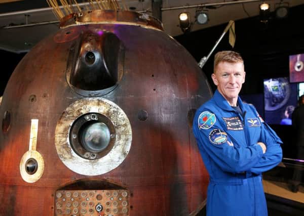 British astronaut Major Tim Peake pictured with the Soyuz TMA-19M - the Space capsule that brought him safely back to Earth after his stint on the International Space Station. Picture: SWNS
