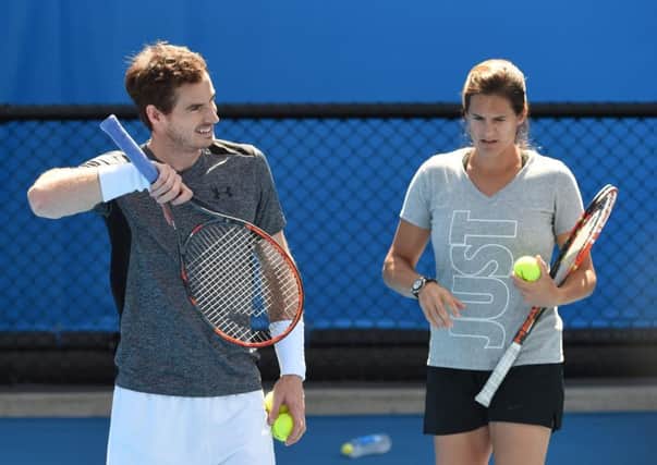 Andy Murray working with his former coach Amelie Mauresmo. Picture: William West/AFP/Getty Images