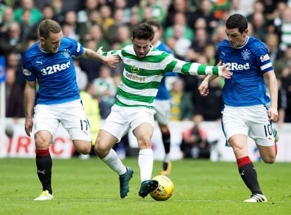 Graham Dorrans, right, wore the captain's armband from the start of the match against Celtic last Saturday. Picture: SNS