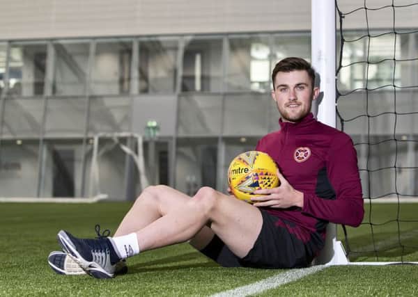 Hearts defender John Souttar is keen to keep learning under Craig Levein, inset. Picture: SNS.
