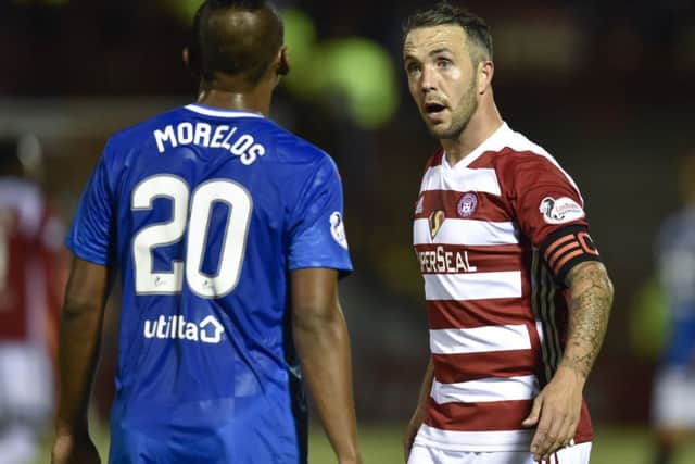 Hamilton's Dougie Imrie exchanges words with Rangers striker Alfredo Morelos. Picture: SNS Group