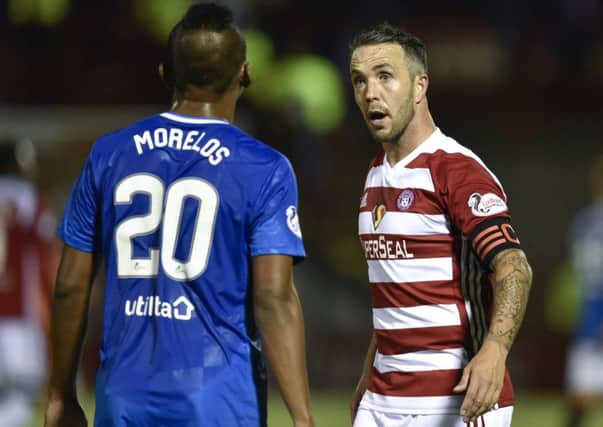 Hamilton's Dougie Imrie exchanges words with Rangers striker Alfredo Morelos. Picture: SNS Group