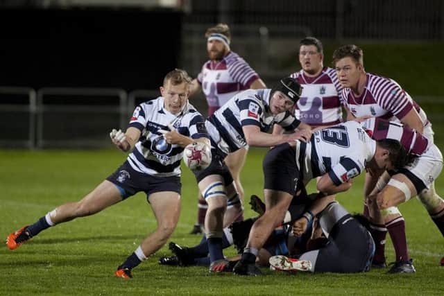 Tim Wilson of Heriot's gets the ball away against Watsonians at Myreside. Picture: Alistair Linford