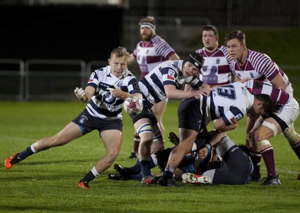 Tim Wilson of Heriot's gets the ball away against Watsonians at Myreside. Picture: Alistair Linford