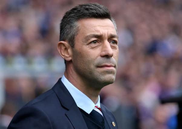 Pedro Caixinha said that Kenny Miller 'is one of ours' when asked about the striker's future at Ibrox. Picture: PA
