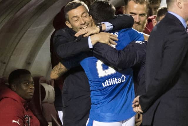 Rangers manager Pedro Caixinha celebrates with Daniel Candeias after scoring his side's third goal. Picture; SNS