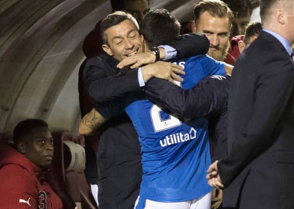 Rangers manager Pedro Caixinha celebrates with Daniel Candeias after scoring his side's third goal. Picture; SNS